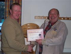 The monthly winner Tony Handford receiving his certificate from Peter Blake